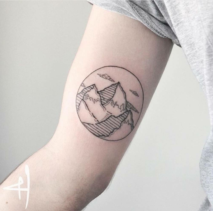 inside the arm tattoo, mountain tattoo ideas, mountain range inside a circle, white background