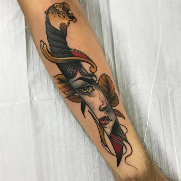 what is a neo traditional tattoo, large knife with a female face reflecting on it, tiger head at the end, forearm tattoo