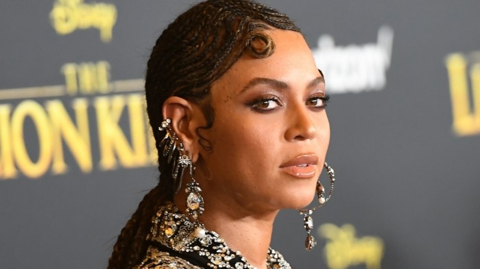 beyonce at the lion king premiere, stud cartilage piercing, hair in brads, wearing multiple earrings with rhinestones