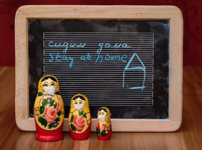 russian dolls with masks, diy face mask for breathing, stay at home written on chalk board