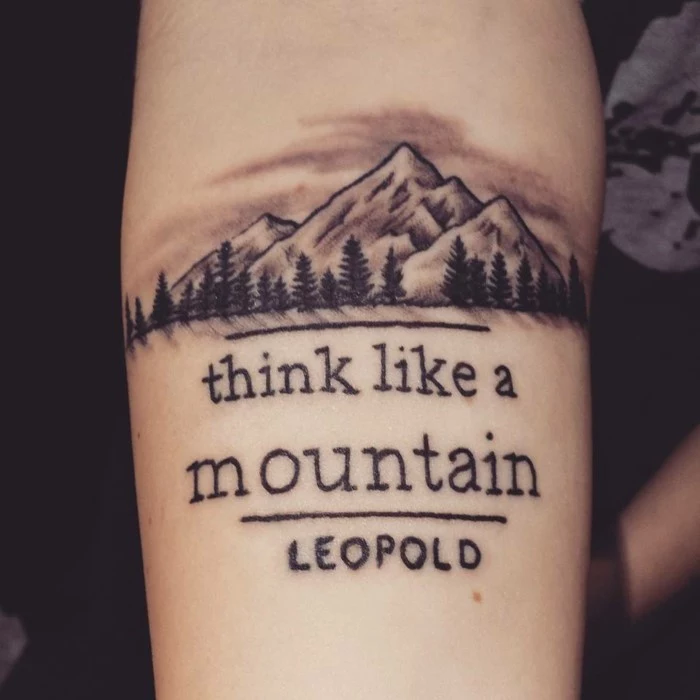 think like a mountain, quote by leopold, written underneath mountain range with trees, mountain tattoo meaning