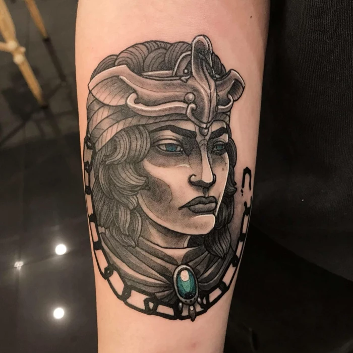 empress queen zenobia, black and grey tattoo wtih blue eyes and blue rhinestone, traditional style tattoos