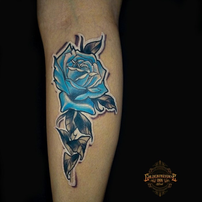 blue rose with white outlineds, back of leg tattoo, traditional girl tattoo, black background