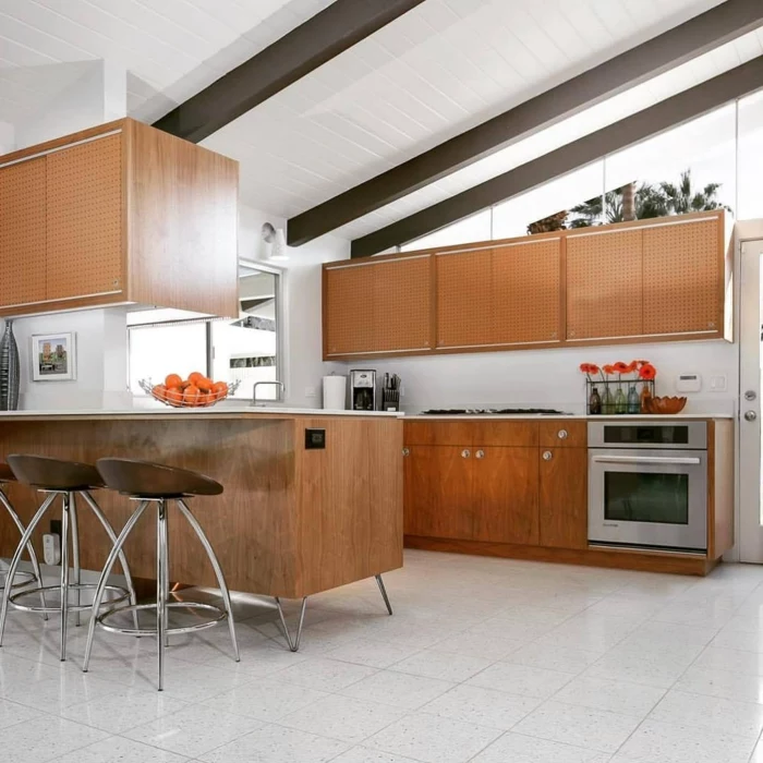 mid century modern kitchen, wooden cabinets with white countertops, white tiles on the floor