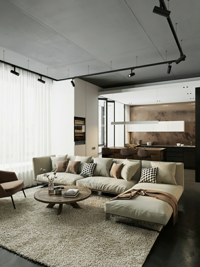 white corner sofa, small round wooden coffee table, contemporary living room, black floor with white carpet