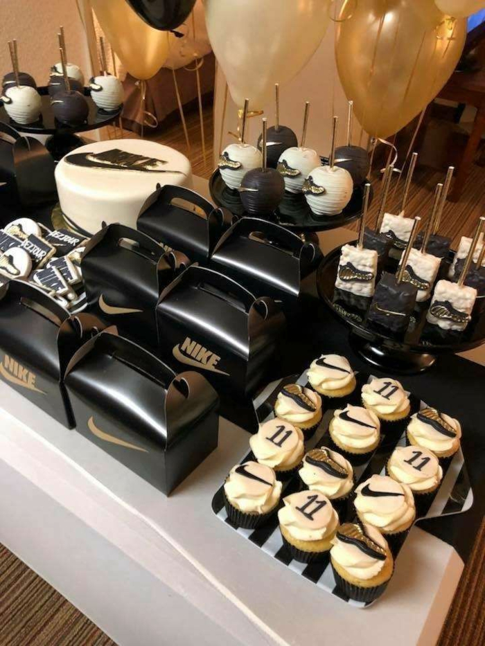 black white and gold decor colors, 18th birthday ideas, nike themed party, desserts table with cake and cake pops