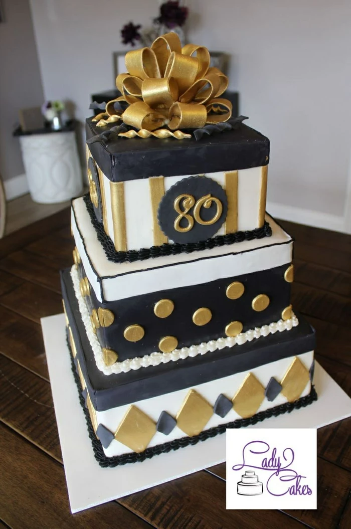 three tier square cake, decorated with black white and gold fondant, happy 80th birthday