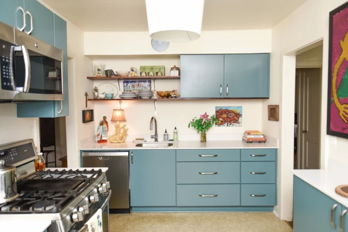 blue cabinets with white countertops, mid century kitchen, open shelving, white backsplash