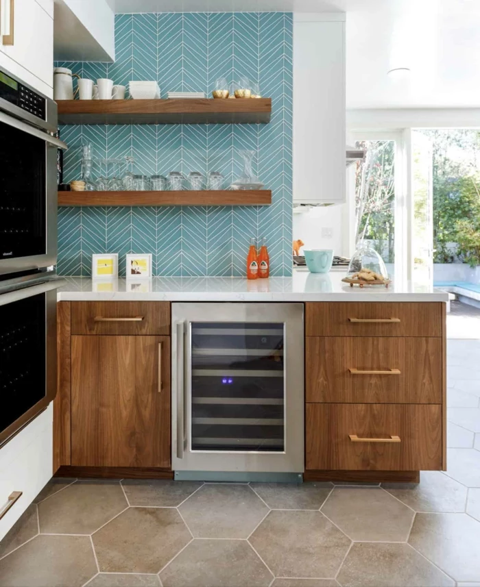blue tiles backsplash, mid century modern cabinet, wooden cabinets with white countertops