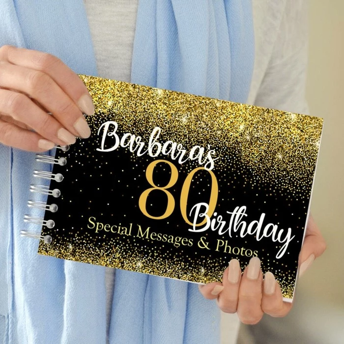 book for special messages and photos, 80th birthday party ideas, black background with gold decorations