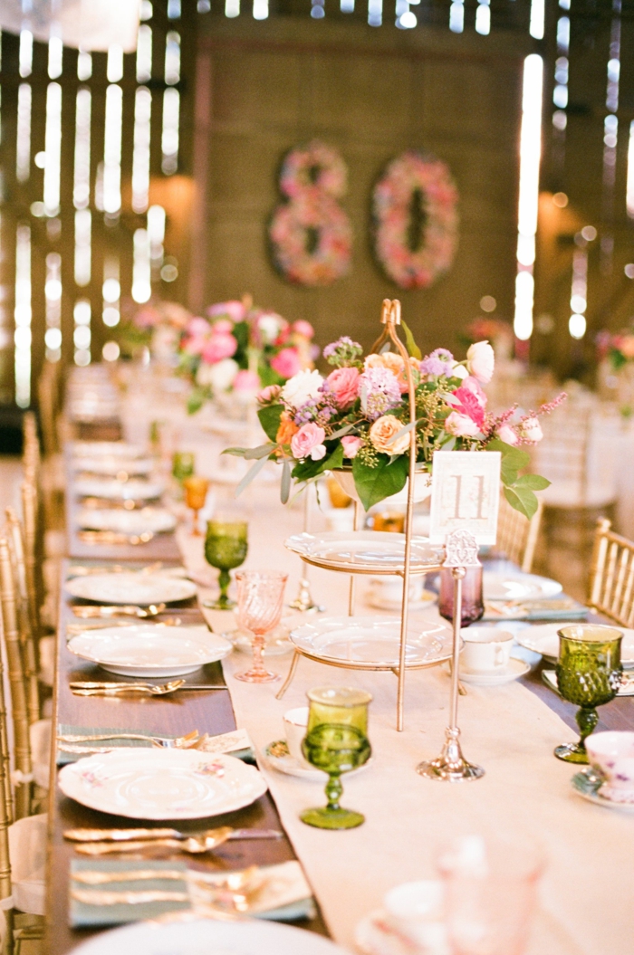 long wooden table, roses flower bouquet arrangements in the middle, 80th birthday ideas for dad