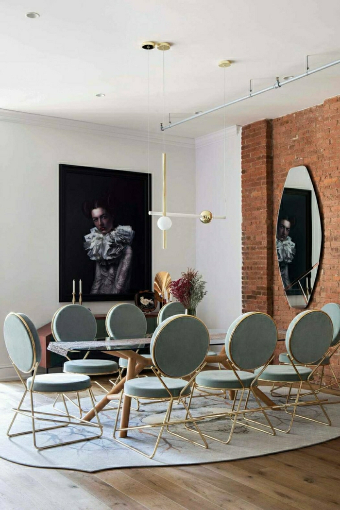 long glass dining table, eight grey chairs arranged around it, modern living room, brick accent wall