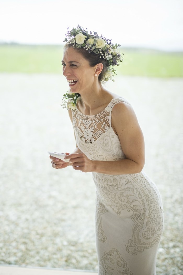 woman laughing, wearing lace wedding dress, what to say in a wedding card, wearing floral crown