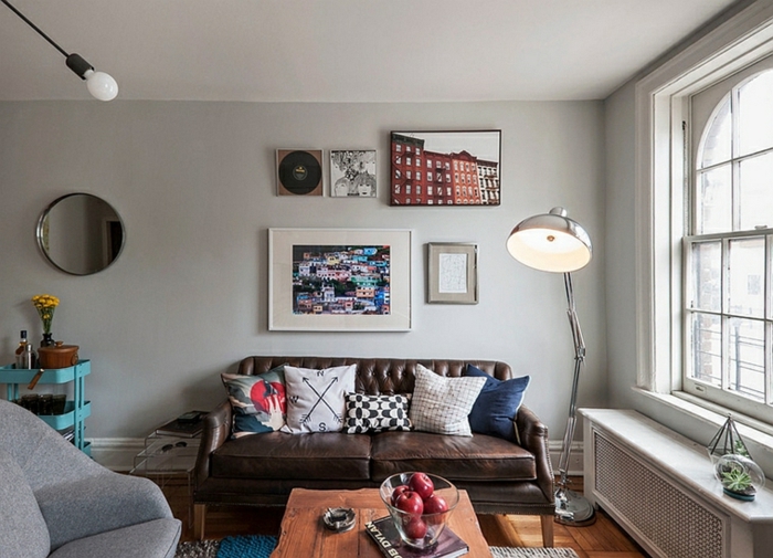 brown leather sofa with colorful throw pillows, wooden coffee table, modern living room decor ideas