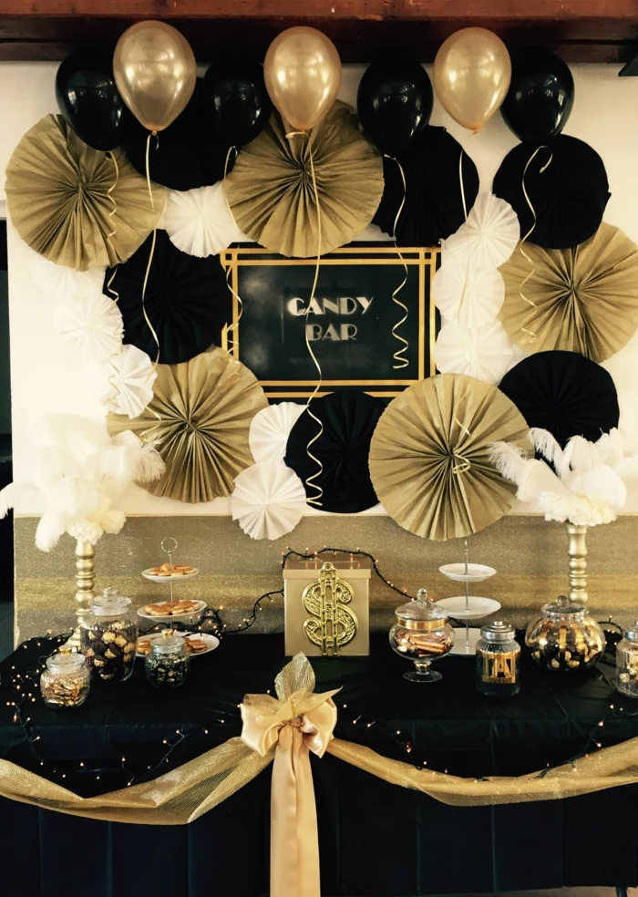 desserts table, black and gold decorations, 80th birthday ideas, black table cloth with gold ribbon