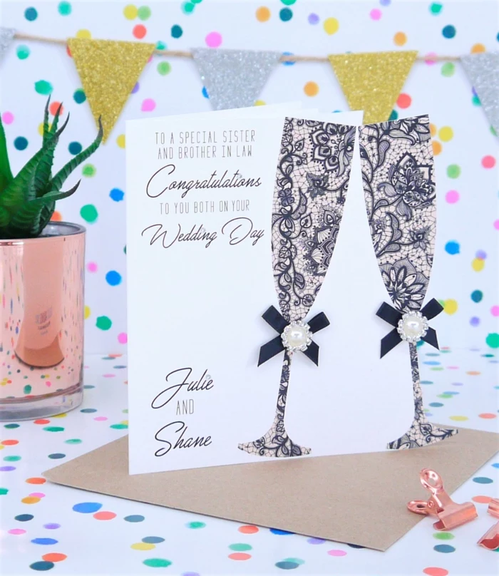 two champagne glasses made of lace, white card stock, what to write in a wedding card