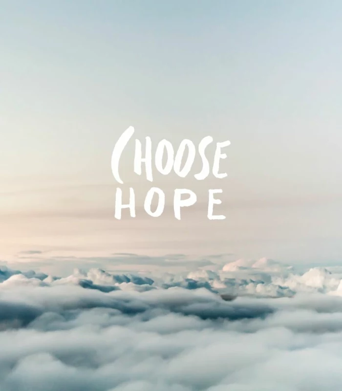 choose hope, written with white letters, background photo from above the clouds