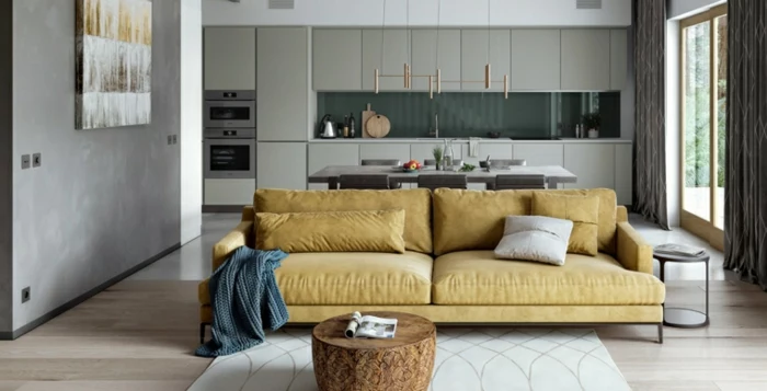 open plan space with kitchen and living room, modern living room decor, yellow sofa, small wooden coffee table