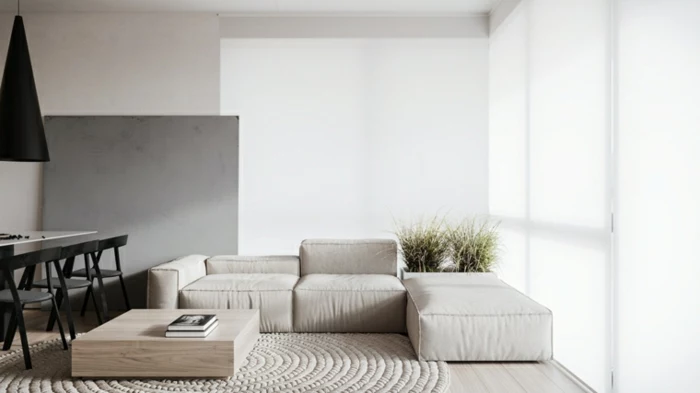 white corner sofa, white dining table with black chairs, modern living room decor, white carpet