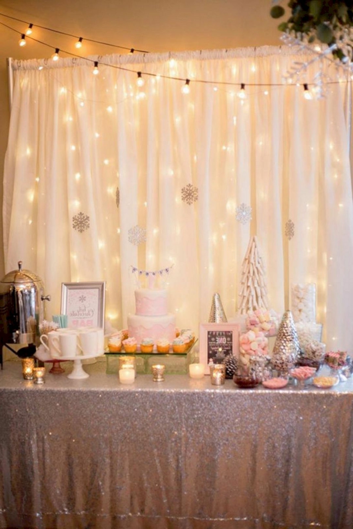 white tulle backdrop with fairy lights, 18th birthday gifts, desserts table with gold table cloth