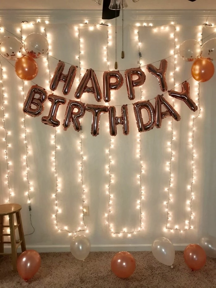 rose gold happy birthday balloons, hanging on white wall, 18th birthday gifts, fairy lights on the wall