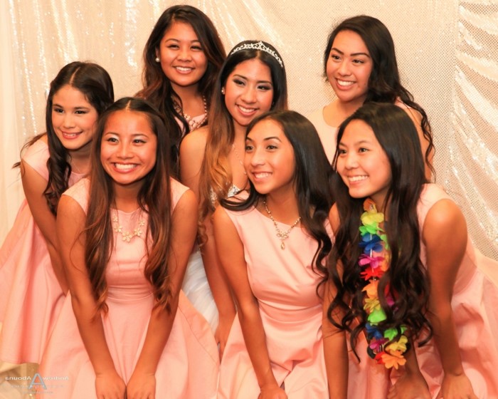 seven girl with long wavy hair, wearing pink dresses, 18th birthday decorations, pink backdrop