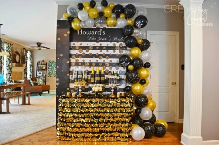 black white and gold balloon arch, hanging over desserts table, 18th birthday ideas for girls