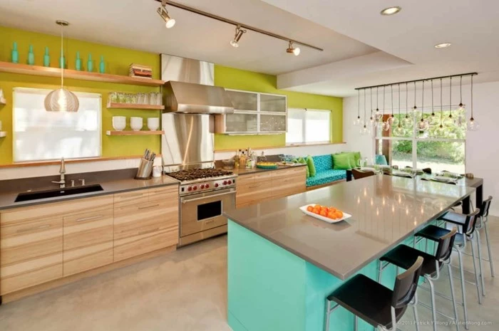 green backsplash, blue kitchen island, mid century modern tile, wooden cabinets with grey countertops