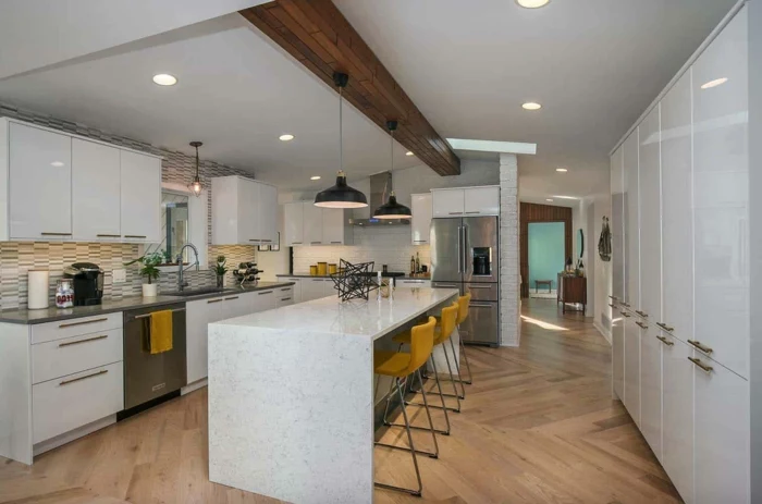 marble kitchen island, mustard yellow bar stools, modular kitchen cabinets, white cabinets with grey countertops