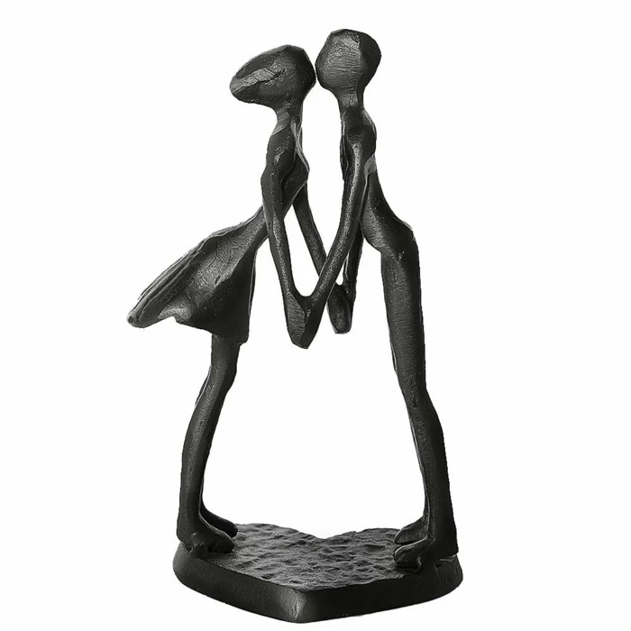 iron sculpture of couple kissing, holding hands, whtie background, traditional anniversary gifts