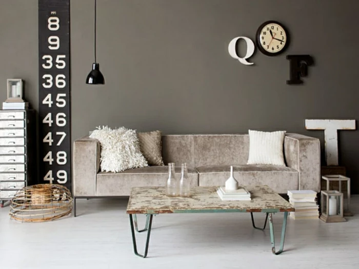 grey walls, modern living room decor ideas, grey sofa, small metal coffee table, white wooden floor