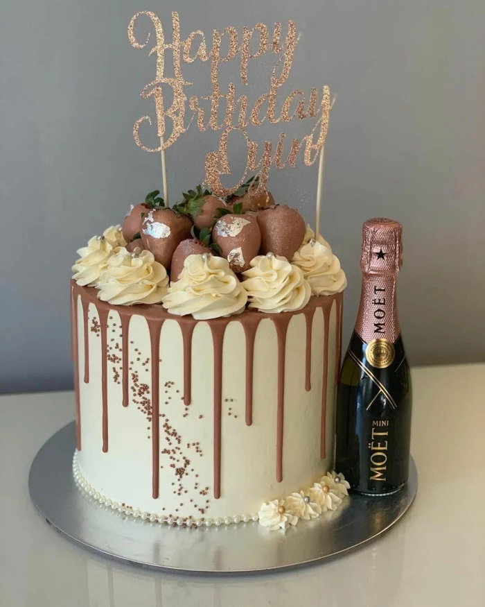 surprise party ideas, one tier cake, chocolate strawberries on top, mini champagne bottle on the side