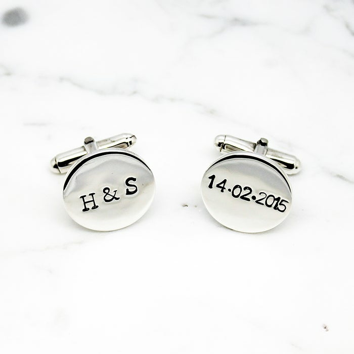 silver cufflinks, personalised with first letters and date, 10th anniversary gift, placed on white surface