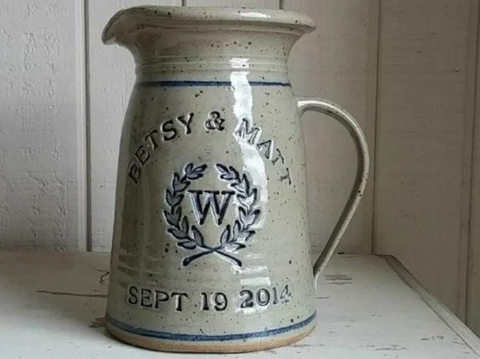 personalised pitcher, betsy and matt, 40th anniversary gifts, dates and names engraved on it, placed on white wooden surface