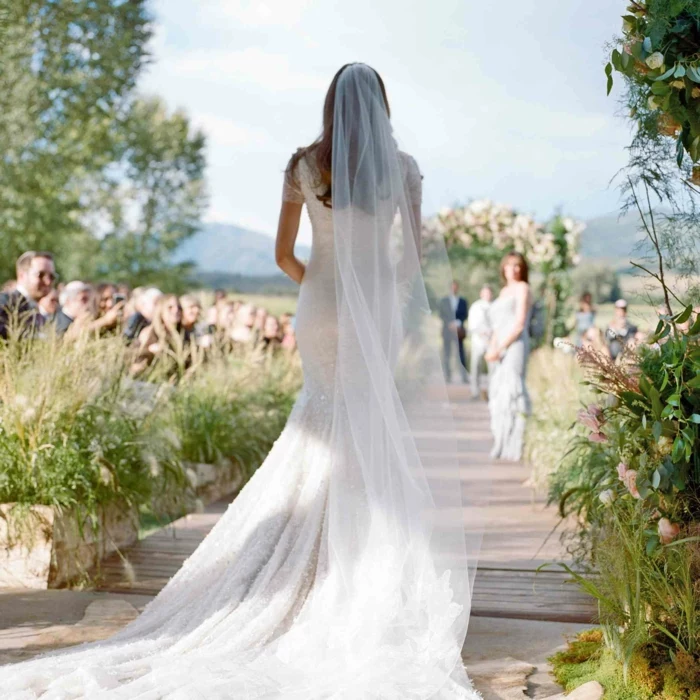 bride walking down the aisle alone, wearing mermaid dress, bride walking down the aisle songs, garden wedding