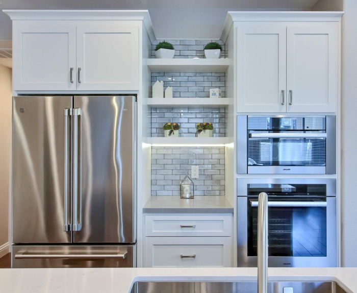 white cabinets, open shelving, mid century modern floor tile, light grey subway tiles backsplash