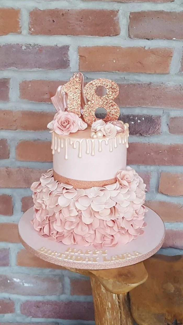 two tier cake, covered with pink fondant and petals, 18th birthday party ideas, rose gold number 18 cake topper
