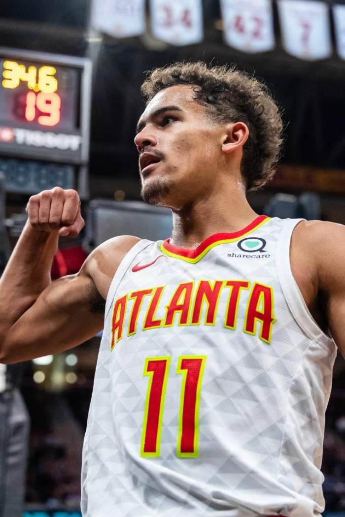 trae young, basketball player wallpaper, wearing atlanta hawks uniform, standing on the court
