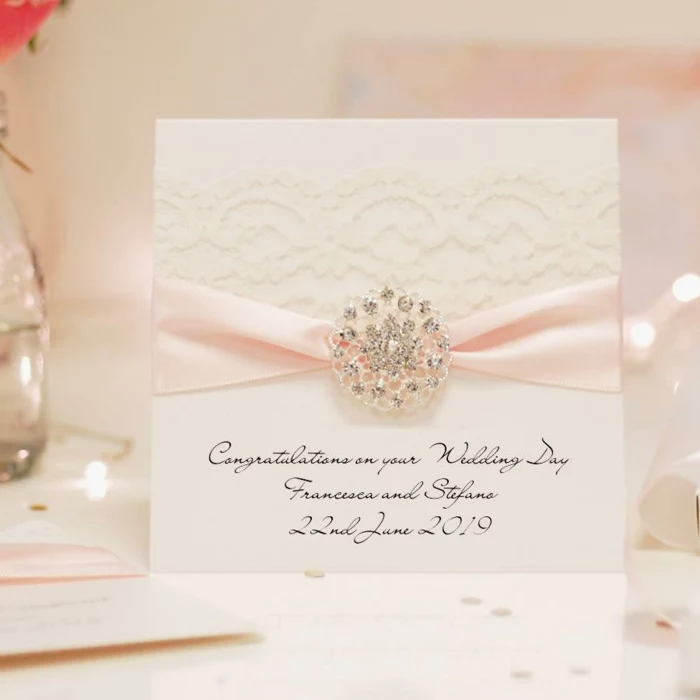 white card stock, decorated with white lace, pink ribbon, what message to write in a wedding card
