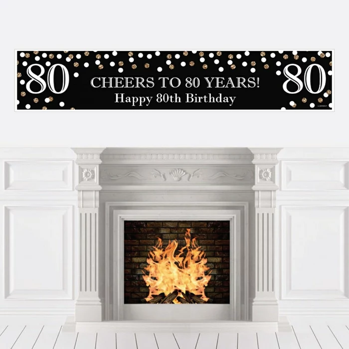 cheers to 80 years banner in black and gold, happy 80th birthday, hanging over a fireplace