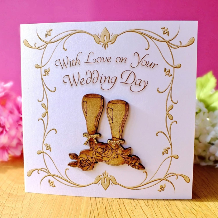 two champagne glasses at the front, what message to write in a wedding card, white card stock