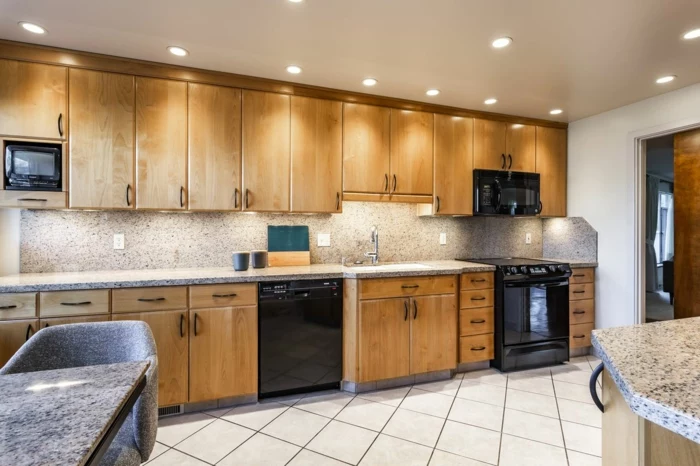 wooden cabinets with granite countertops, mid century modern kitchen appliances, mosaic backsplash