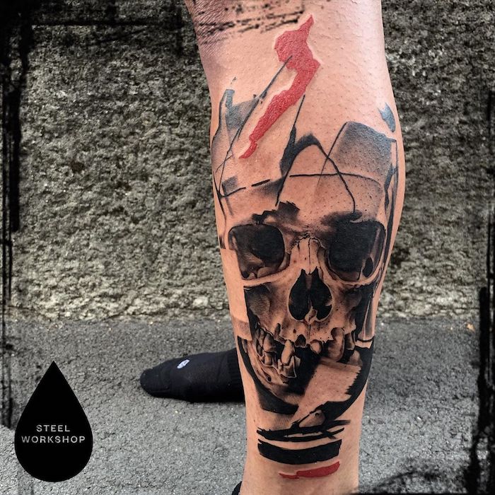 Abstract skull tattoo located on the pelvis