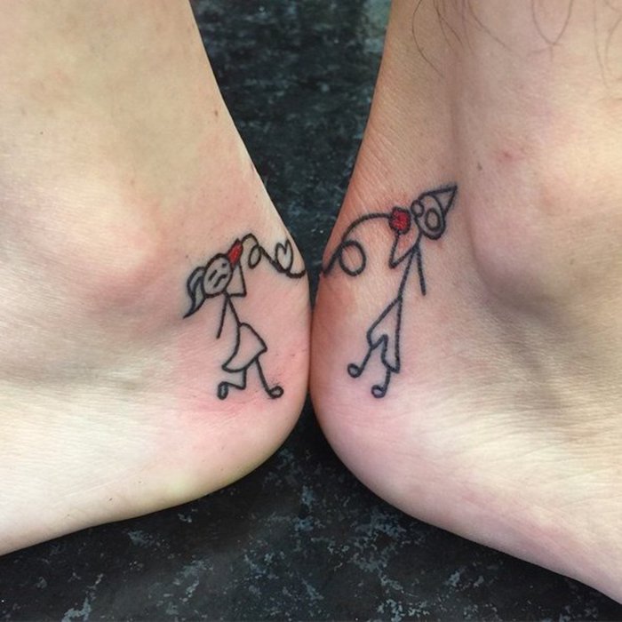 ankle tattoos of boy girl stick figures holding cans for phones matching sibling tattoos