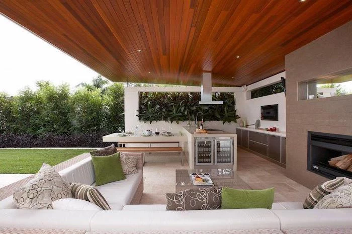 backyard kitchen ideas outdoor lounge area with fireplace large white corner sofa kitchen island with fridge
