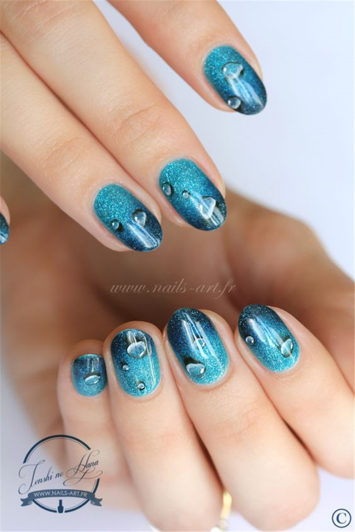 blue glitter nail polish, rain drops decorations, summer nail designs, medium length squoval nails