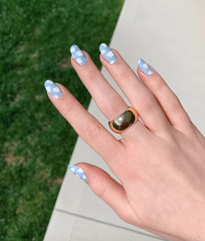 medium length squoval nails, summer nail colors, blue nail polish, white clouds decorations