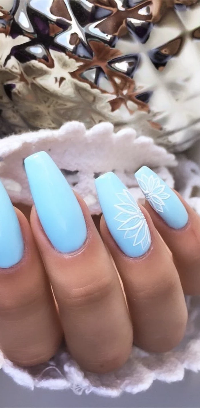 summer nail colors, blue nail polish, white flowers decorations, long coffin nails