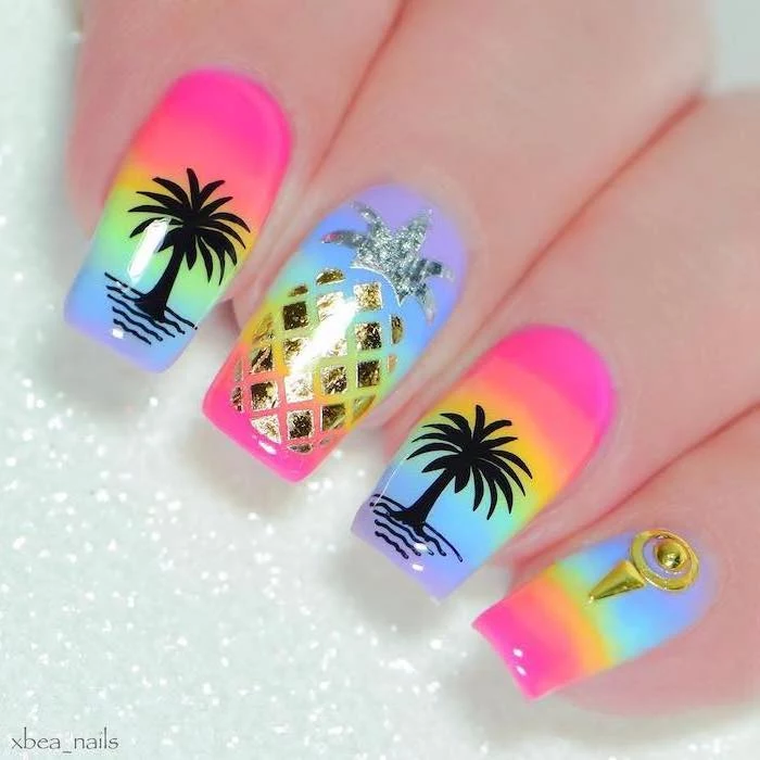 rainbow nail polish, pineapple and palm trees decorations, rhinestones on the pinky, summer nail colors