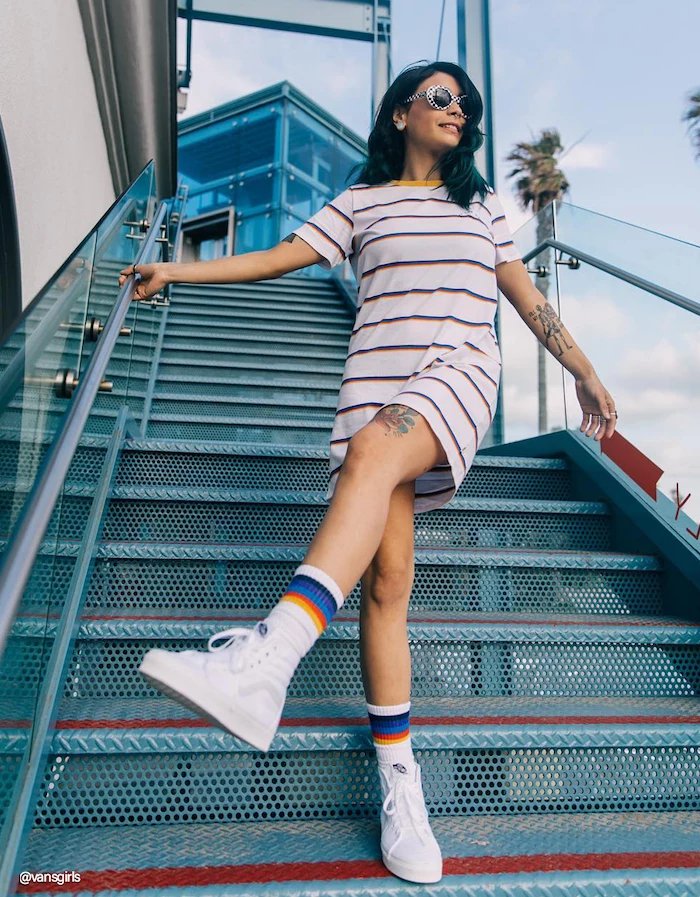 cute outfit ideas woman with black hair wearing wide t shirt dress white high top sneakers sunglasses